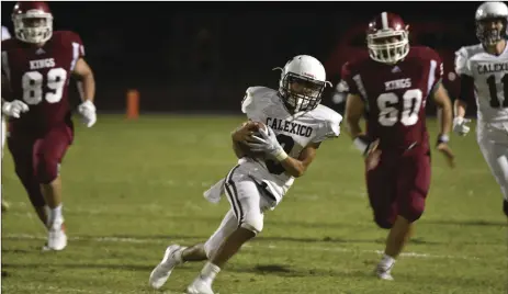  ?? PHOTO AARON BODUS ?? Calexico quarterbac­k Luis Meza (3) runs the ball in Friday’s win over Kofa High School, in Yuma.