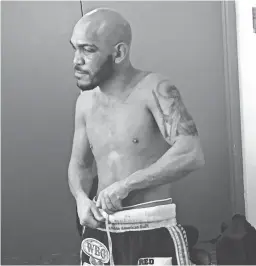  ??  ?? Ray Beltran ponders his future in the dressing room after suffering a 12-round unanimous decision loss to Jose Pedraza on Saturday.