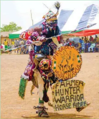  ??  ?? A costumed reveller at the Jos Carnival