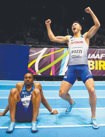 ?? Picture: GETTY ?? Briton Andrew Pozzi celebrates winning the World Indoor 60m hurdles as American Aries Merritt looks bewildered.