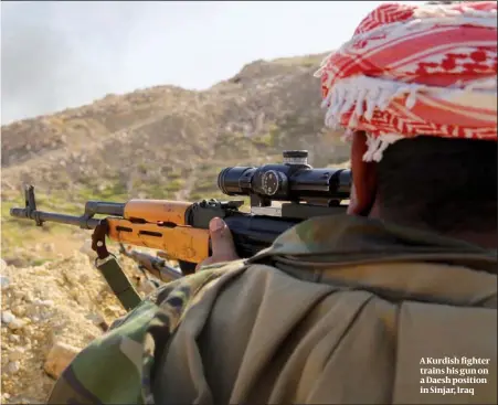  ?? PHOTO: GETTY IMAGES ?? A Kurdish fighter trains his gun on a Daesh position in Sinjar, Iraq