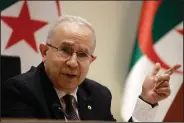  ?? (AP/Fateh Guidoum) ?? Algerian Foreign Minister Ramtane Lamamra reads a statement from the country’s president Tuesday, saying the nation was cutting ties with Morocco.