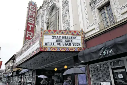  ?? Justin Sullivan / Getty Images ?? A marquee in San Francisco announces the theater’s closure because of a statewide rule banning gatherings of more than 250.