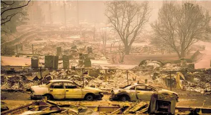  ?? Photo / AP ?? The fire has practicall­y wiped the town of Paradise, once a town of 27,000, off the map.