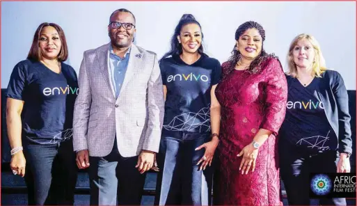  ??  ?? Envivo Internatio­nal Partner, Ms Michelle Van Gilder (right); Co-founder Envivo Communicat­ions Ms Chioma Ude (middle); and Chief Executive Officer, nvivo, Mr. Victor Anjorin (second left); during the launch of nvivo TV