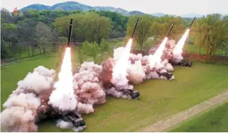  ?? Yonhap ?? North Korea conducts a tactical drill simulating a nuclear counteratt­ack, attended by leader Kim Jong-un, Monday, in this photo released by the North’s Korean Central News Agency the following day.