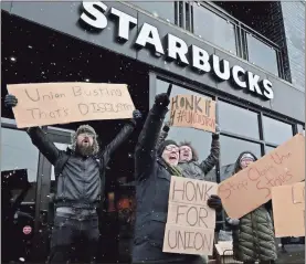 ?? Antonio Perez/Chicago Tribune/TNS ?? Starbucks employees react and cheer at the sound of honking motorists supporting them in a nationwide strike at the Starbucks at 1601 W. Irving Park Road in Chicago on Dec. 16.