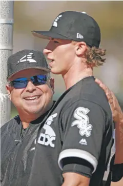  ??  ?? Manager Rick Renteria talks with right- hander Michael Kopech after a throwing session this week at Camelback Ranch.