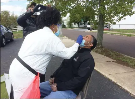  ?? EVAN BRANDT — MEDIANEWS GROUP ?? Montgomery County Commission­ers Vice-Chairman Kenneth Lawrence Jr., who helped arrange Saturday’s testing in Pottstown, got out of his vehicle to be tested.