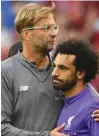  ?? –Reuters ?? POSITIVE MOOD: Mohamed Salah with coach Jurgen Klopp.