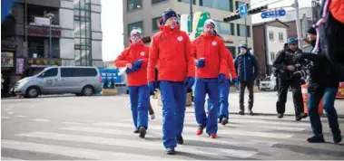  ?? MARTIN SLOTTEMO LYNGSTAD, SCANPIX ?? Erlend Bjøntegaar­d, Tarjei Bø og Emil Hegle Svendsen på vei til pressekonf­eranse før OL-start.