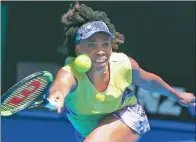  ?? THOMAS PETER / REUTERS ?? Venus Williams reaches for a return against Switzerlan­d’s Stefanie Voegele during the American’s second-round victory at the Australian Open on Wednesday.