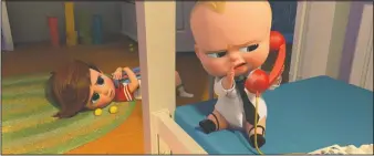  ?? [DREAMWORKS ANIMATION] ?? Tim (voiced by Miles Bakshi) discovers the surprising secret Boss Baby (voiced by Alec Baldwin) is hiding.