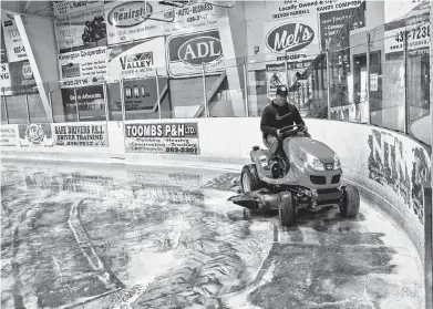  ?? JASON SIMMONDS/JOURNAL PIONEER ?? Kensington Credit Union Centre manager Robert Wood cleans the ice surface Tuesday morning. The ice had to be removed following a power outage caused by post-tropical storm Dorian and was to be reinstalle­d this week.