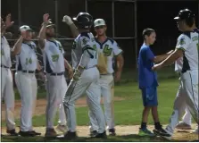  ?? MIKE CABREY/MEDIANEWS GROUP ?? Skippack’s Charlie Hooker (7) is congratula­ted after his two-run homer run in the fourth inning against Valley Forge in Game 1of the Perk League finals on Monday.