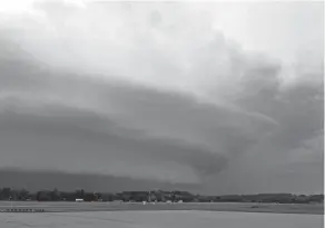  ?? LEE BOLEN ?? The storm system that passed through Wednesday created some unique cloud formations as it went over Ohio University Airport in Athens County.