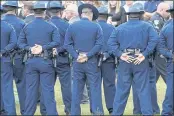  ?? ROGELIO V. SOLIS — THE ASSOCIATED PRESS ?? Troopers gather during the burial services for Louisiana State Police Master Trooper Chris Hollingswo­rth in West Monroe, La., on Sept. 25.