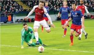  ?? — AP ?? Arsenal’s Aaron Ramsey (second left) has an attempt on goal during the Europa League quarterfin­al against CSKA Moscow.