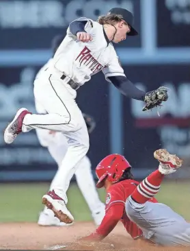  ?? WM. GLASHEEN/USA TODAY NETWORK-WISCONSIN ?? Timber Rattlers second baseman Dylan O'Rae, left, tries to tag Won-Bin Cho of Peoria during a game April 5 at Neuroscien­ce Group Field at Fox Cities Stadium.