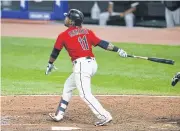  ??  ?? The Indians’ Jose Ramirez hits a walk-off three-run home run off the White Sox’s Jose Ruiz during the 10th inning.