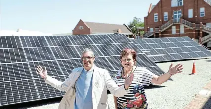  ?? Picture: JACKIE CLAUSEN ?? HERE COMES THE SUN: Kingswood College head Leon Grové and bursar Soné Griesel watch with excitement as the solar farm goes up on the Kingswood campus. The school is hoping to supply 70% of its electricit­y from the plant. Read the full story on this page.