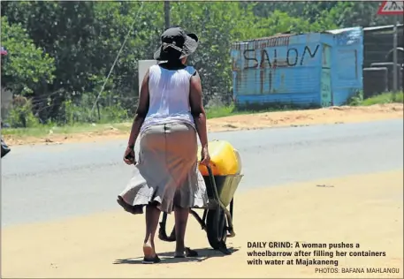  ?? PHOTOS: BAFANA MAHLANGU ?? WHITE ELEPHANT: The water meters that have been installed in all households since 2007, but there is no water in the area DAILY GRIND: A woman pushes a wheelbarro­w after filling her containers with water at Majakaneng THE troubled Madibeng local...