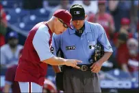  ?? RICH SCHULTZ — THE ASSOCIATED PRESS ?? Philadelph­ia Phillies’ manager Joe Girardi (25) argues with home plate umpire Alfonso Marquez during the ninth inning of a baseball game against the Los Angelas Dodgers, Thursday in Philadelph­ia, Pa.