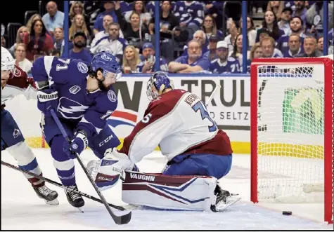  ?? Tribune News Service ?? Tampa Bay lightning center Anthony Cirelli (71) beats Colorado Avalanche goaltender darcy Kuemper (35) as the puck
slides into the goal for a first period game tying goal in Game 3 of the Stanley Cup final Monday.