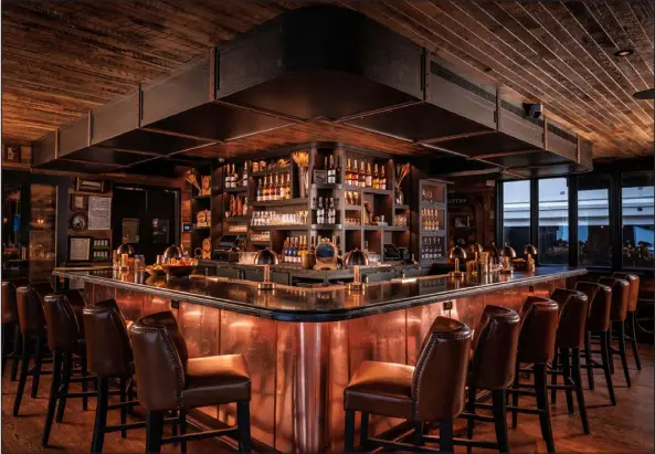  ?? PHOTOS PROVIDED BY STRANAHAN’S ?? The Stranahan’s Whiskey Lodge is in a 1,833-square-foot building off of Wagner Park in Aspen. The space features a main bar, lounge area with couches and a private dining room for private events.