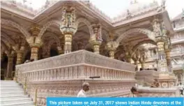  ??  ?? This picture taken on July 31, 2017 shows Indian Hindu devotees at the nearly 200 years old Swaminaray­an Kalupur Temple. — AFP photos