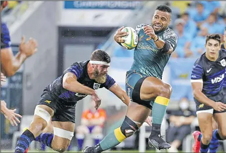  ?? Picture: RA ?? Australia’s Samu Kerevi breaks the tackle of Argentina’s Marcos Kremer in an earlier match.