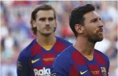  ??  ?? Barcelona forward Lionel Messi (right) looks on next to his teammate Antoine Griezman prior of the Joan Gamper trophy soccer match between FC Barcelona and Arsenal at the Camp Nou stadium in Barcelona, Spain, on Aug. 4. AP PhoTo/JoAN moNforT