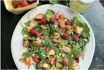  ?? Pittsburgh Post-Gazette/TNS ?? Fresh, local strawberri­es add a sweet touch to this easy spring salad with fried chicken.