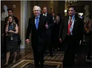  ?? BILL O’LEARY — THE WASHINGTON POST ?? Senate Minority Leader Mitch McConnell (R-Ky.) walks out of a leadership meeting at the Capitol on Wednesday.