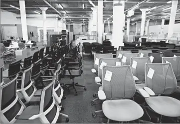  ??  ?? Office chairs are lined up at Office Furniture Center in Chicago’s Lawndale neighborho­od.