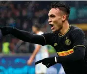  ?? AP ?? Lautaro Martinez of Inter Milan celebrates after scoring his side’s second goal during the Italian league match against Spal at the Giuseppe Meazza stadium in Milan, Italy, on Sunday. —