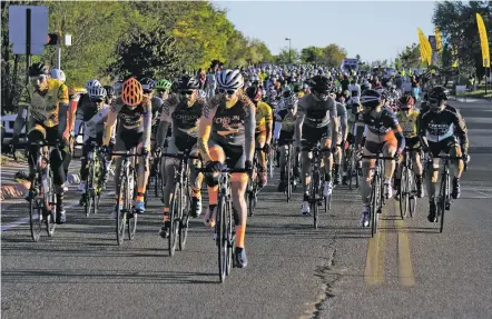  ?? PHOTOS BY LUKE E. MONTAVON/FOR THE NEW MEXICAN ?? More than 2,200 riders participat­ed in the various divisions of the Santa Fe Century bicycle event on Sunday. Racers began and finished at Christus St. Vincent Medical Center.