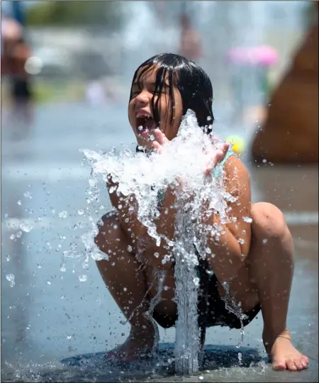  ?? VINCENT OSUNA PHOTO ?? Jeanna Zermeño, 7, enjoys playing in the splash pad at Alyce A. Gereaux Park in Brawley on Saturday afternoon.