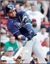  ??  ?? Tampa Bay Rays’ Nelson Cruz connects on an RBI-double against the Boston Red Sox during the 10th inning of a baseball game, on Sept. 6, at Fenway Park in Boston. (AP)