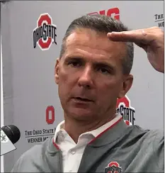  ??  ?? Ohio State NCAA college football head coach Urban Meyer gestures while speaking at a press conference in Columbus, Ohio, on Monday.AP PhoTo/MITch STAcy