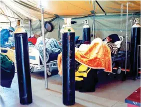  ?? AP PHOTO/JEROME DELAY ?? COVID-19 patients are treated with oxygen at the Tshwane District Hospital on July 10 in Pretoria, South Africa.