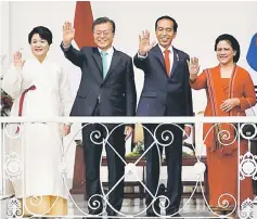  ??  ?? Moon (second left), his wife Kim Jung-sook (left), Widodo and first lady Iriana wave to the media from the balcony of the presidenti­al palace in Bogor, south of Jakarta, Indonesia. — Reuters photo