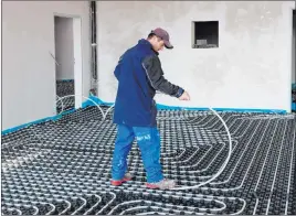  ?? Tribune News Service ?? Radiant heating beneath the floor is an efficient and unobtrusiv­e heating method.