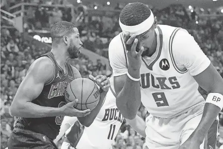  ?? MARK HOFFMAN/ MILWAUKEE JOURNAL SENTINEL ?? Bucks center Bobby Portis is fouled by Bulls center Tristan Thompson on Wednesday night.