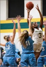  ?? JAMES BEAVER/FOR MEDIANEWS GROUP ?? Lansdale Catholic’s Timaya Lewis-Eutsey (3) gets a shot off over a number of North Penn arms during their game on Thursday, Jan. 2, 2020.