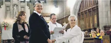  ?? JEFF SHENG, AP ?? Brenda Sue Fulton, left, and Penelope Gnesin get married at West Point’s Cadet Chapel in December.