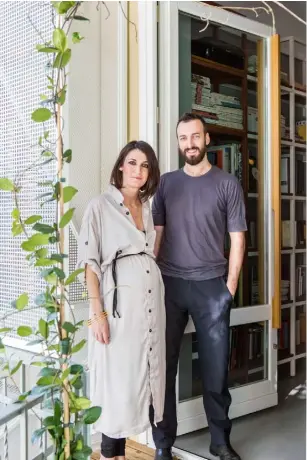 ??  ?? Portrait Homeowners Eirini Giannakopo­ulou and Stefano Carera Living room The TV unit, benches and sofa were designed by the homeowners. They sit beside classic pieces, from the ‘Gräshoppa’ floor lamp by Greta Grossman for Gubi to the orange plastic...