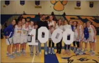  ?? PHOTO COURTESY OF DOWNINGTOW­N EAST HIGH SCHOOL ?? Downingtow­n East junior Bella Smuda scored her 1,000th point Wednesday, a baseline jumper against Coatesvill­e in the Cougars’ 45-40 win.