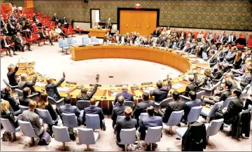 ??  ?? The United Nations Security Council votes to renew an internatio­nal inquiry into chemical weapons attacks in Syria, during a meeting at the United Nations headquarte­rs in New York, US. — Reuters photo