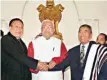  ?? PTI ?? New Nagaland CM Shurhozeli­e Liezietsu (Right) greets former CM T R Zeliang after the swearing-in ceremony at Kohima, Nagaland, on Wednesday